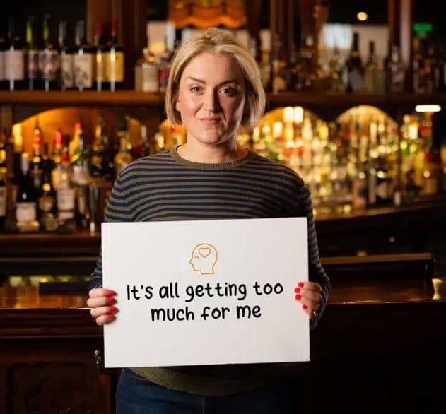 Woman holding sign